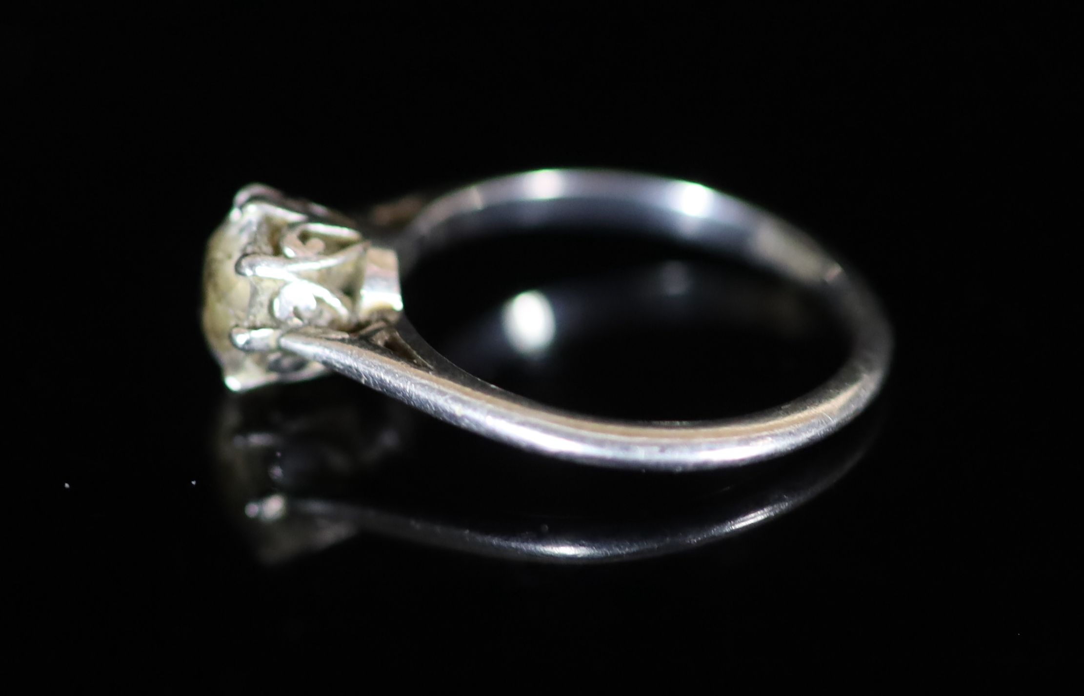 An 18ct white gold and solitaire diamond ring